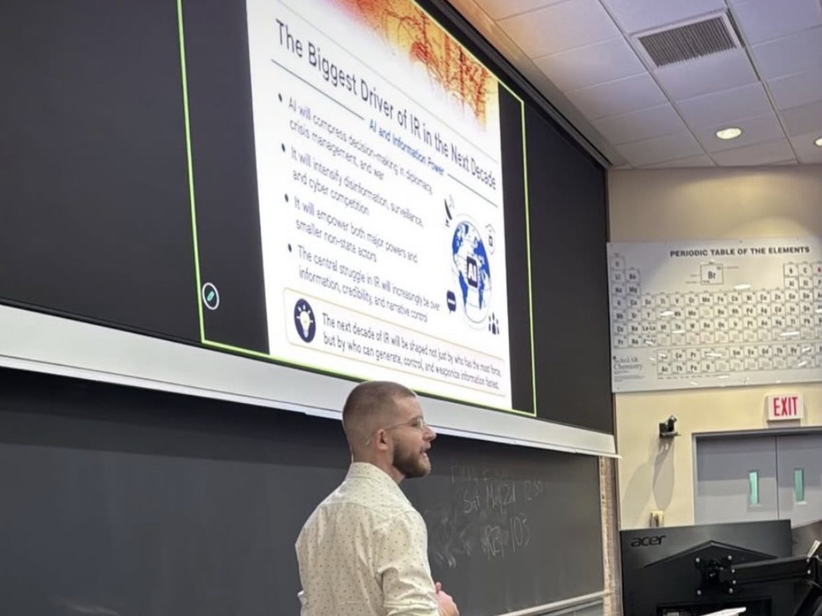Caleb Johnston leading a classroom discussion on international relations.