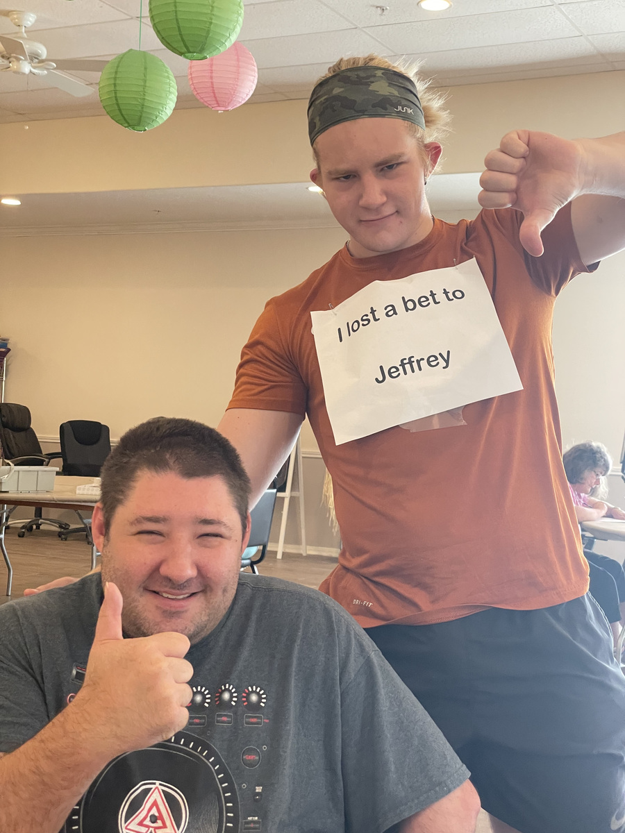 Caleb Johnston sharing a playful moment with a participant at Special Angels.
