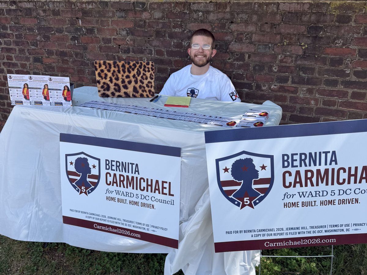 Caleb Johnston staffing a Carmichael for Ward 5 Council outreach table.